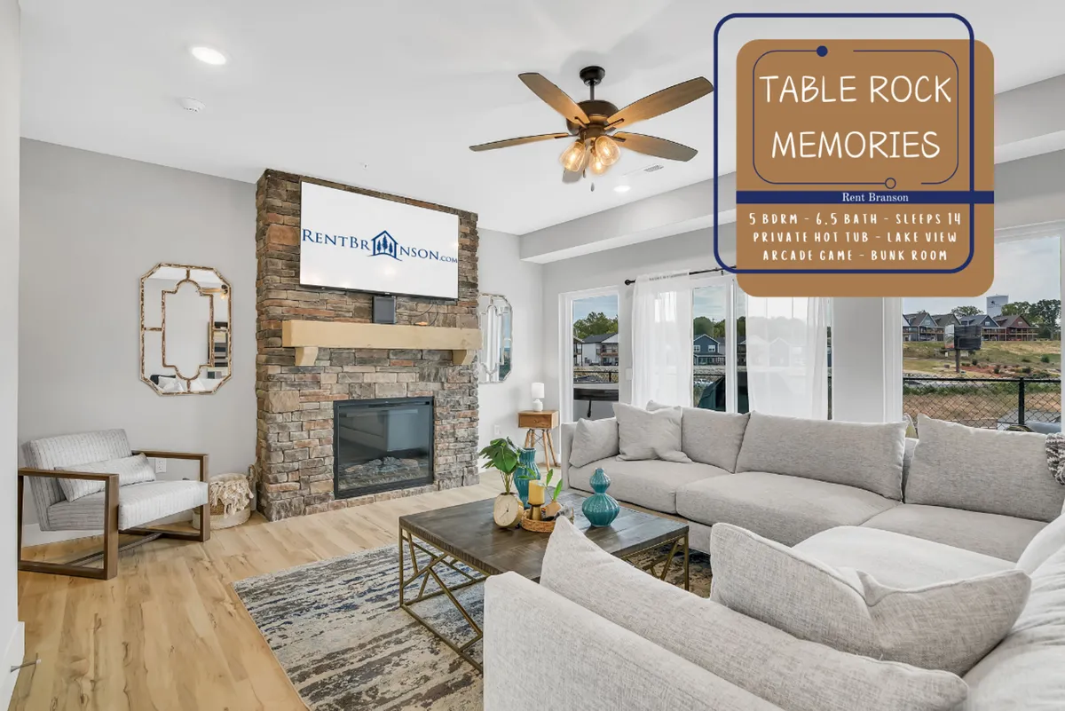 An inviting upstairs lounge area featuring a large sectional sofa, a stone fireplace, a TV mounted on the wall, and a coffee table. The setup suggests a cozy movie zone and a space for games or relaxation, ideal for both kids and families.